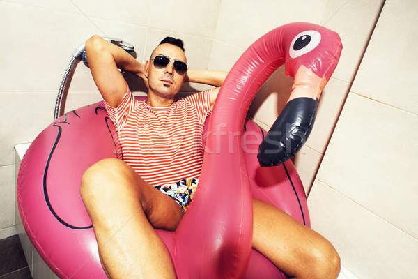 man with a swim ring relaxing in the bathroom Stock photo © nito