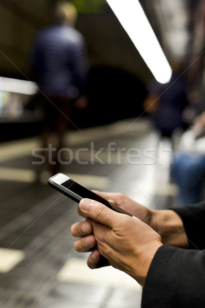 男子 智能手機 地下 站 年輕 商業照片 © nito
