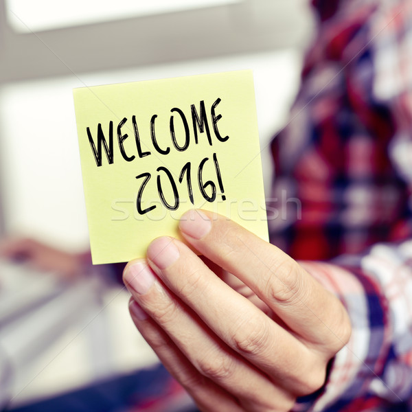 young man with a sticky note with the text welcome 2016 Stock photo © nito