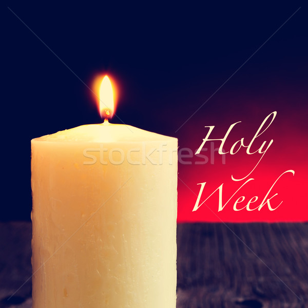 a lit candle and the text holy week Stock photo © nito