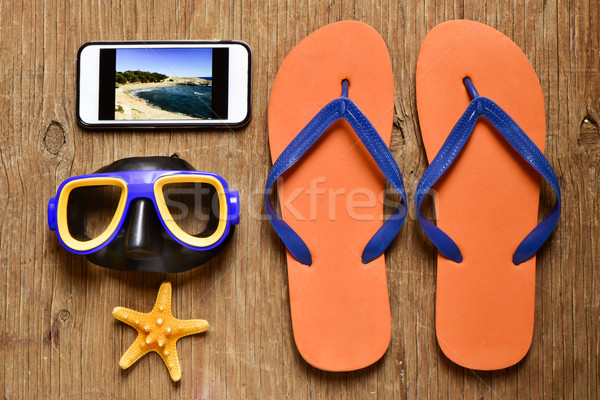 smartphone and some summer stuff on a rustic wooden table Stock photo © nito