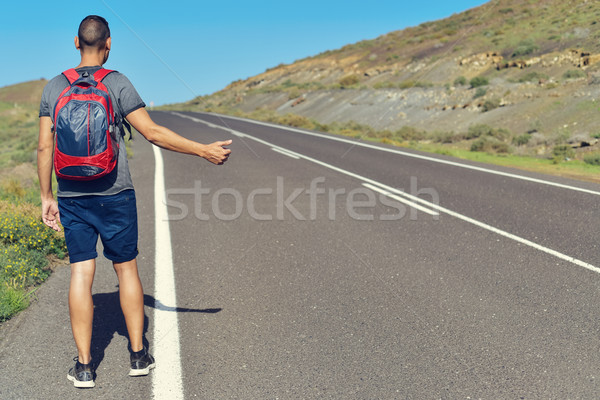 young man hitchhiking Stock photo © nito