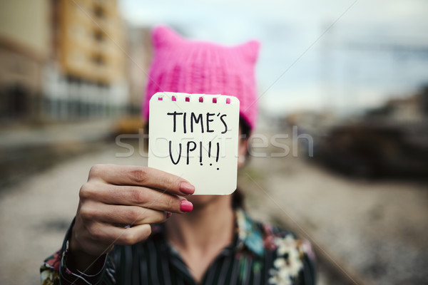 woman with a pink hat and the text time is up Stock photo © nito