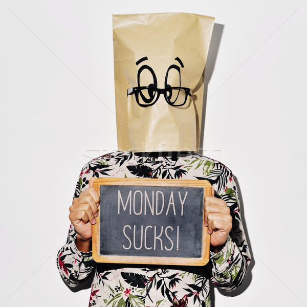 man with a chalkboard with the text monday sucks Stock photo © nito