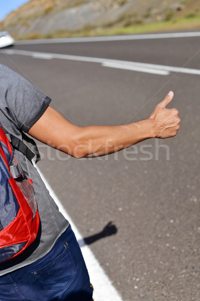 young backpacker man hitchhiking Stock photo © nito