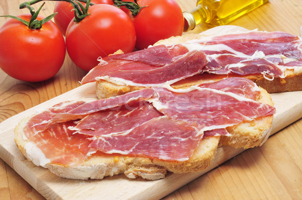 Stock photo: sliced of bread with serrano ham served as tapas