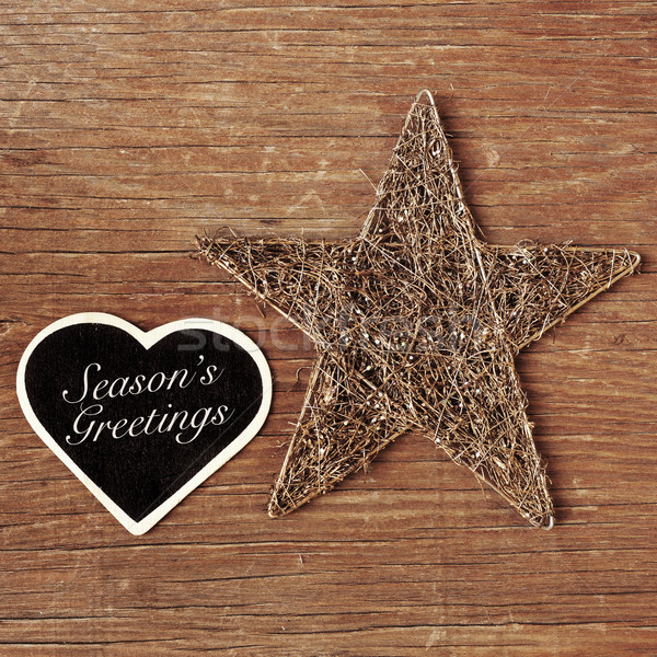 seasons greetings written in a heart-shaped chalkboard Stock photo © nito