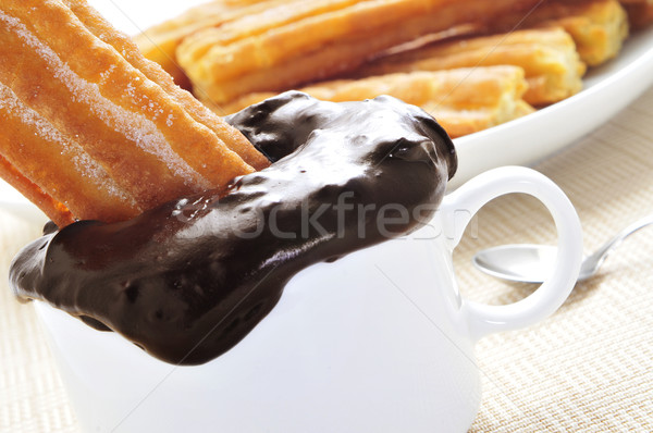 porras, thick churros typical of Spain, dipped in hot chocolate Stock photo © nito