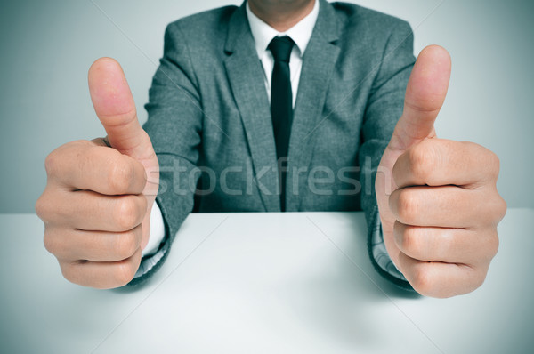 man in suit giving a thumbs up signal Stock photo © nito