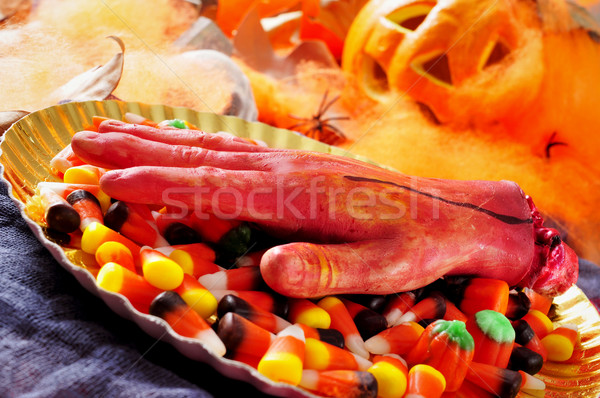 amputated hand and Halloween candies Stock photo © nito