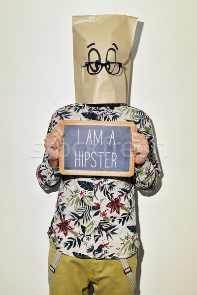 man with chalkboard with text I am a hipster Stock photo © nito