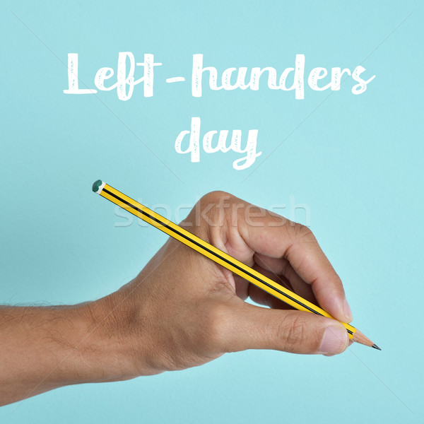 text left-handers day and the hand of a lefty Stock photo © nito