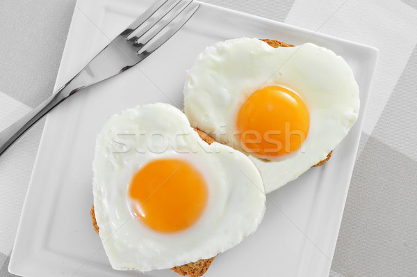 heart-shaped fried eggs Stock photo © nito