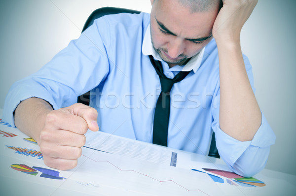 businessman observing a chart with a downward trend Stock photo © nito