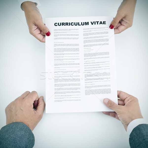 young woman and man with a curriculum vitae Stock photo © nito