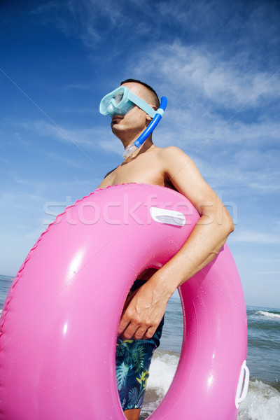 man on the beach with diving mask and swim ring Stock photo © nito