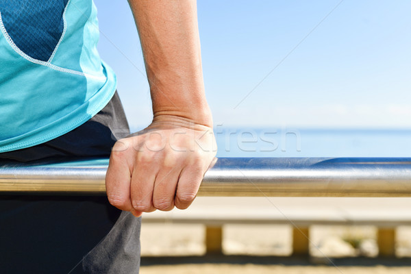 young sportsman doing exercises in a metal bar Stock photo © nito