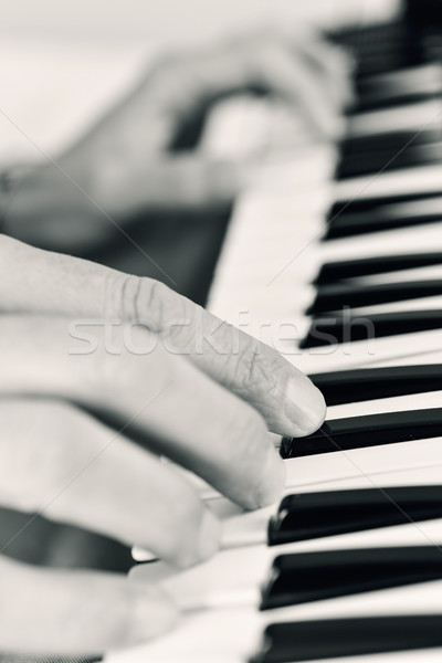 young man playing an electronic keyboard Stock photo © nito