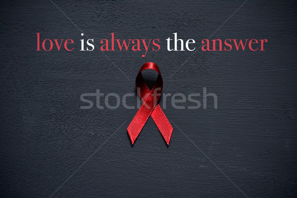 red ribbon and text love is always the answer Stock photo © nito