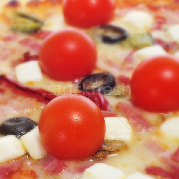 Stock photo: pizza with bacon, olives, cherry tomatoes, goat cheese, green pe