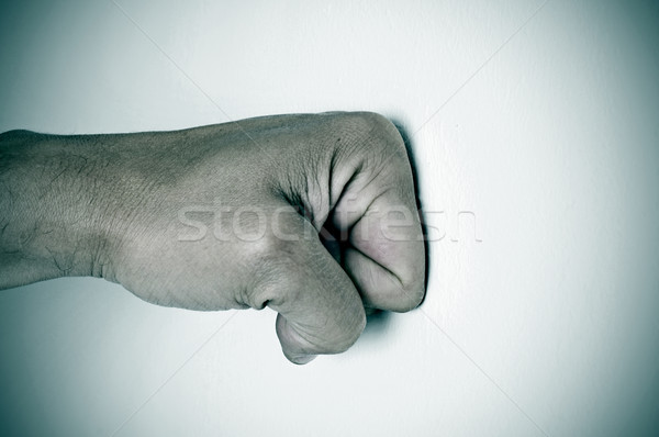 man fist punching a white surface Stock photo © nito