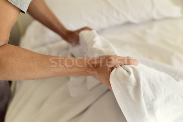 young man making the bed Stock photo © nito