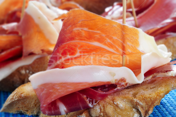 spanish pinchos de jamon, serrano ham served on bread Stock photo © nito