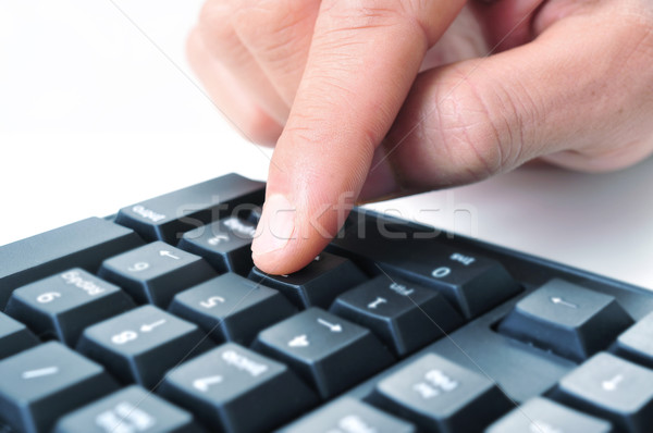 man using the numeric keypad of a computer keyboard Stock photo © nito