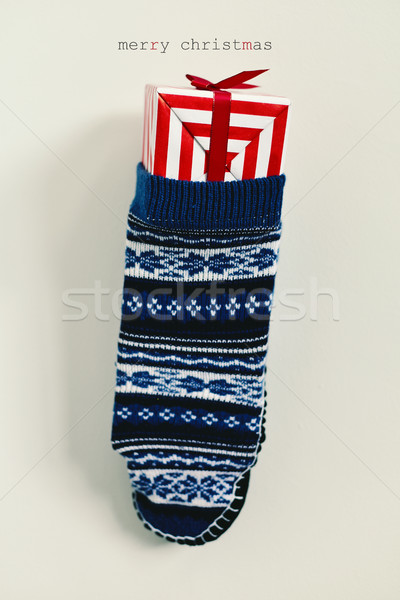 Stock photo: gift in a stocking and text merry christmas