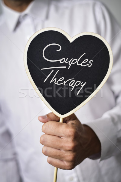 man with signboard with text couples therapy Stock photo © nito