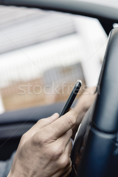 businessman using a smartphone in a car Stock photo © nito