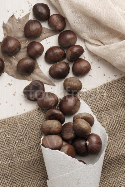 Stock photo: chestnuts on a table
