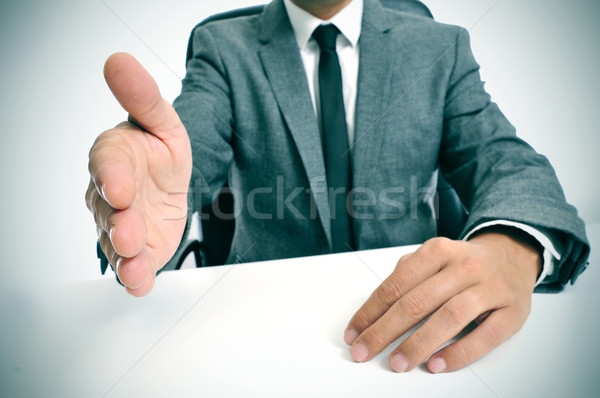 man in suit offering to shake hands Stock photo © nito