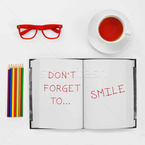 text dont forget to smile written in a notepad Stock photo © nito