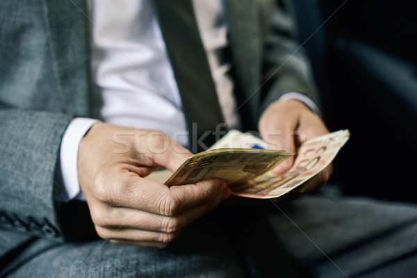 man counting euro bills in the back of a car Stock photo © nito