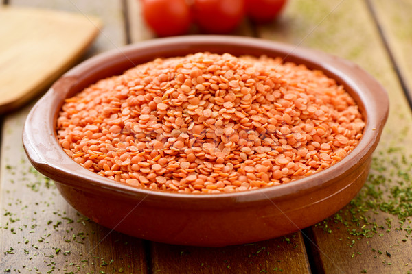 uncooked red lentils in an earthenware bowl Stock photo © nito