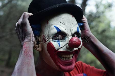 Foto d'archivio: Scary · male · clown · coltello · boschi · primo · piano