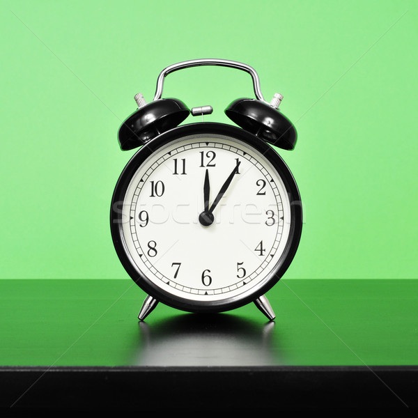 mechanical alarm clock on a bedside table Stock photo © nito