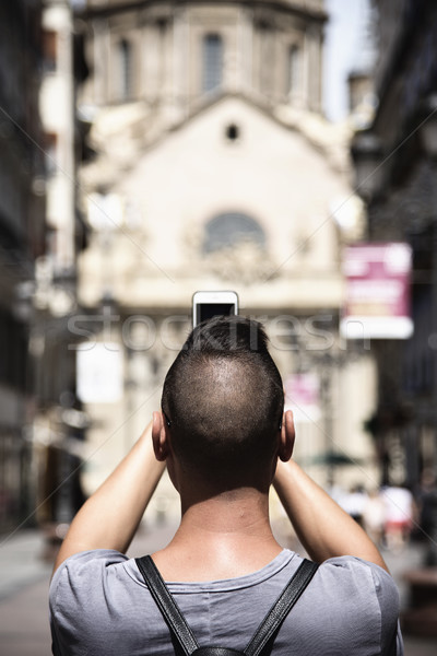 Stock photo: man taking a photo of the Pilar in Zaragoza, Spain