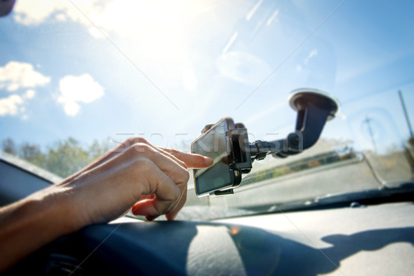 young man using a smpartphone while driving a car Stock photo © nito