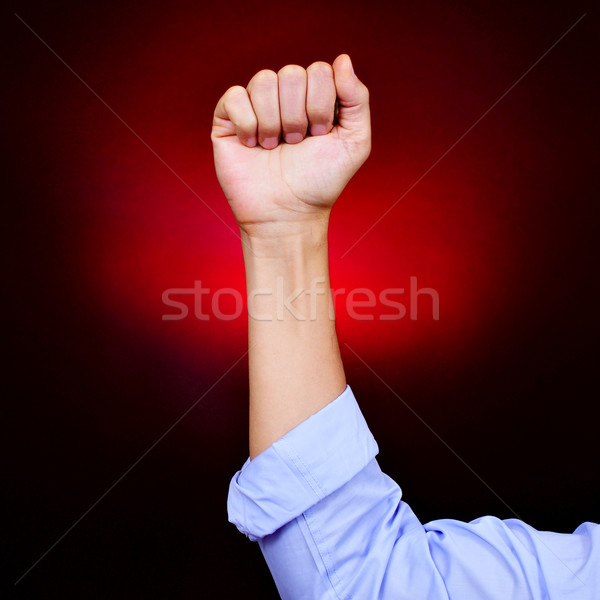 raised fist of a young man Stock photo © nito