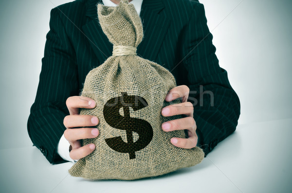 man in suit with a burlap money bag Stock photo © nito