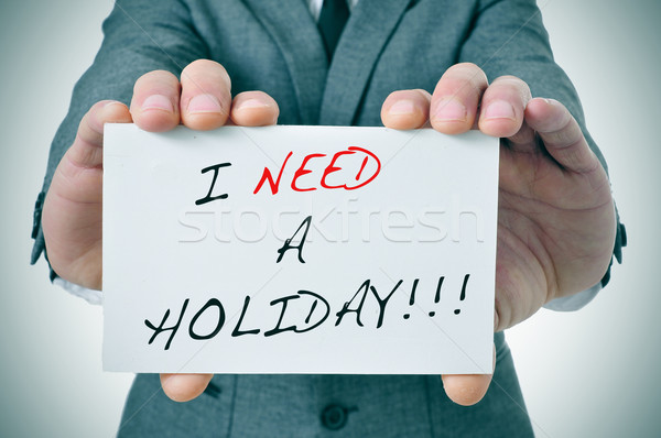 Nevoie vacanţă om de afaceri text scris Imagine de stoc © nito