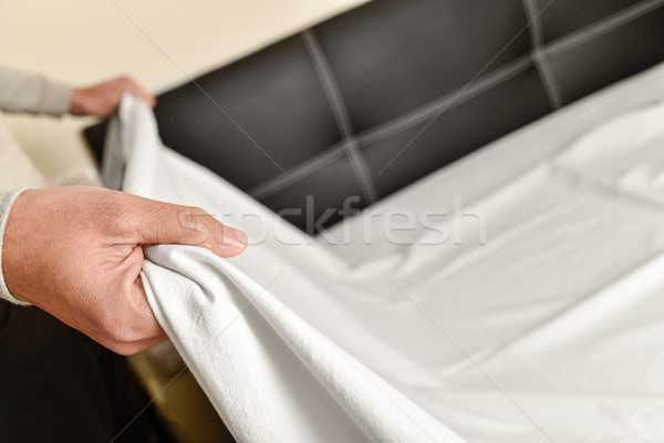 young man making the bed Stock photo © nito