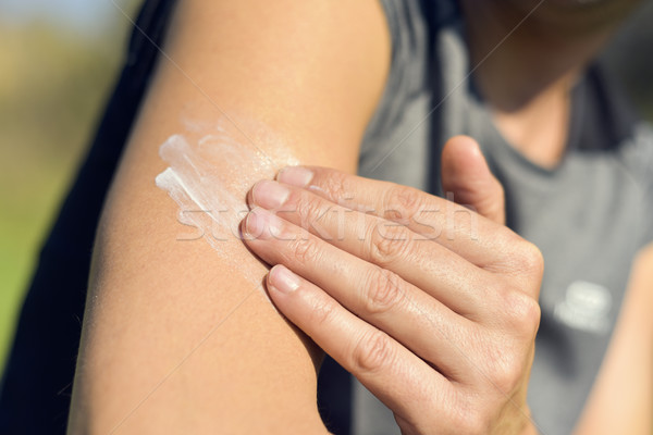 man applying sunscreen to his arm Stock photo © nito