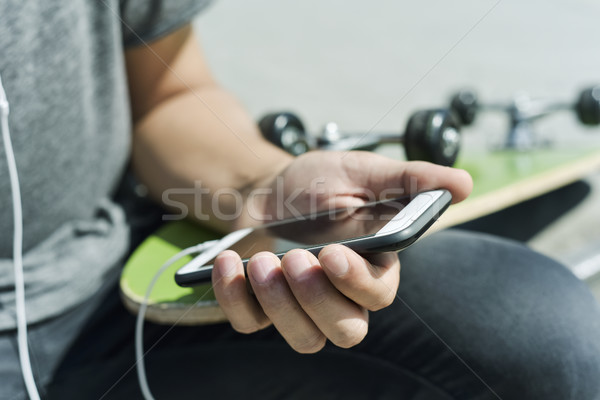 skater man using his smartphone Stock photo © nito