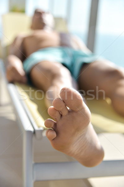 young man sun tanning in a sunlounger Stock photo © nito