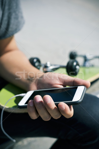skater man using his smartphone Stock photo © nito