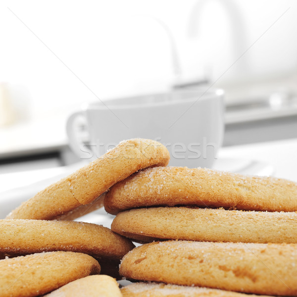 ladyfingers and a cup of coffee or tea on the kitchen table Stock photo © nito