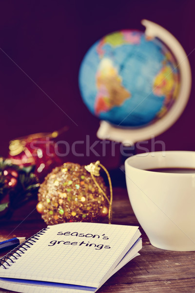 bauble, cup of coffee, globe and text seasons greetings Stock photo © nito
